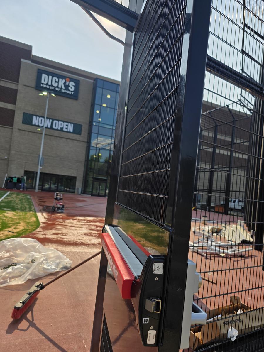 Panic exit device installed on security gate at Dick's House of Sport